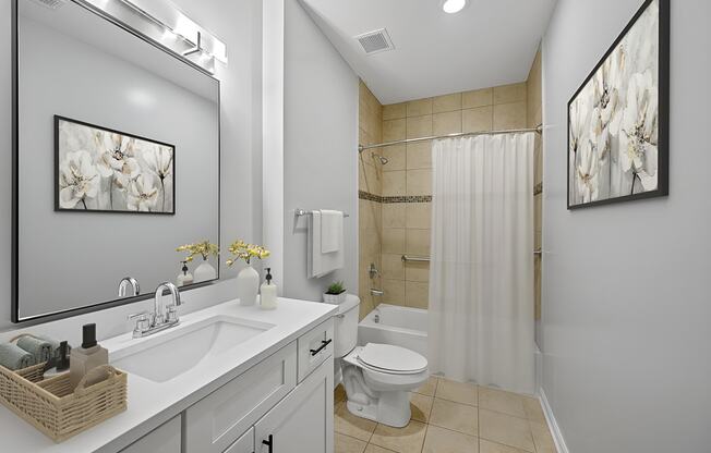 a bathroom with a sink toilet and a shower