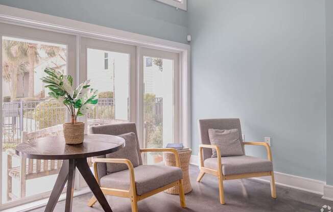 A room with a table and two chairs.