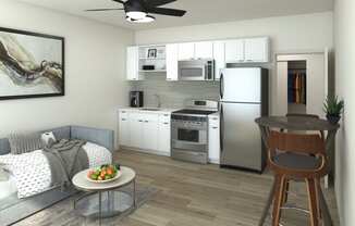 a small living room with a couch and a table at Presidio Palms Apartments, Arizona, 85701