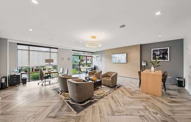 A spacious office with wooden floors and modern furniture.