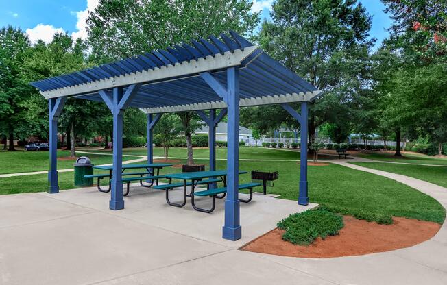 Covered picnic area with grill stations at Ashley Oaks Apartments in Greensboro, North Carolina