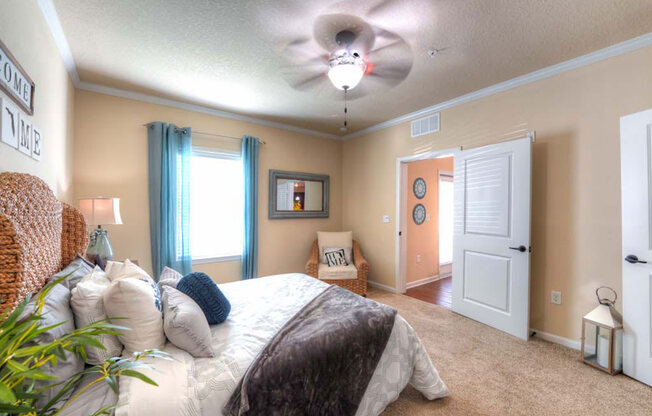 a bedroom with a bed and a ceiling fan  at Cabana Club - Galleria Club, Jacksonville, FL, 32256