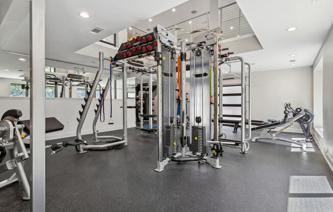 Community Fitness Center with Equipment and Upstairs Area at Dunwoody Village Apartments in Atlanta, GA.