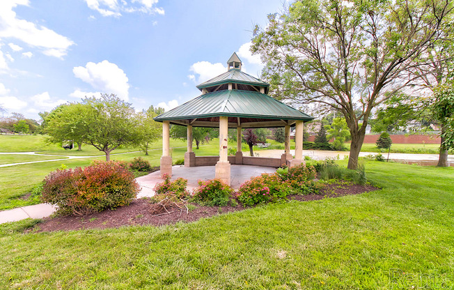 a gazebo in the middle of a park