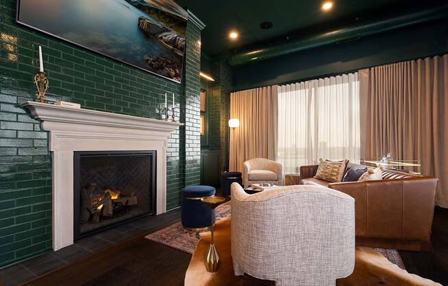 a living room with a fireplace and a large painting on the wall1 at The Bohen Apartments , Minnesota