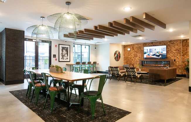 a dining room with a table and chairs and a television