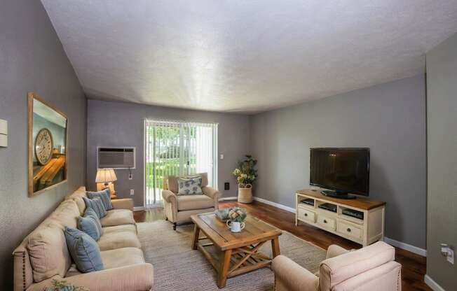 a living room with a couch and a television