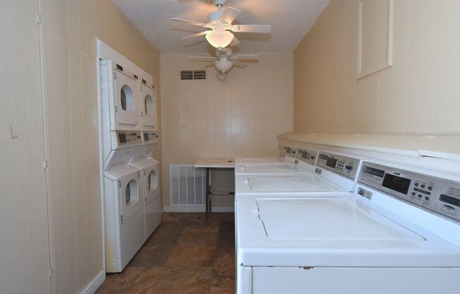 a washer and dryer are in the laundry room