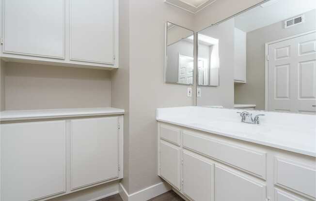 renovated bathroom with updated cabinets