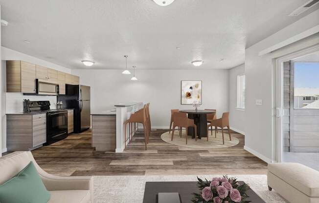 a living room and dining room with a table and chairs