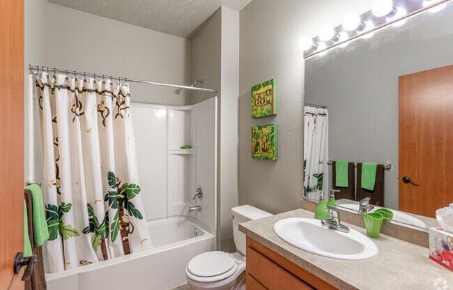 a bathroom with a sink toilet and bathtub