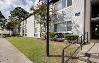 A white building with a blue sign on the front.