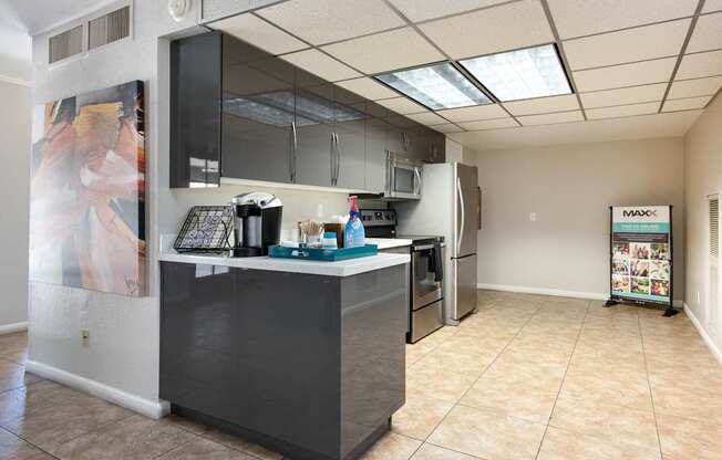 a kitchen with a counter and a refrigerator