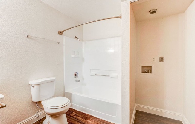 Bathroom with washer and dryer connections at Country Club at The Meadows Senior Apartments in Las Vegas, NV, For Rent. Now leasing 1 and 2 bedroom apartments.