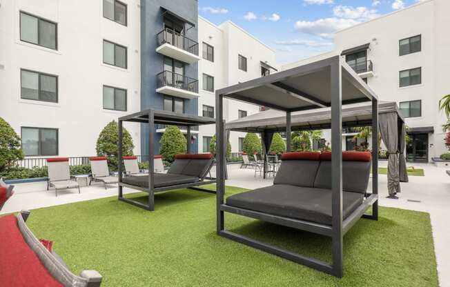 Shaded cabanas by the pool at Bay Village 1 in Palmetto Bay, FL