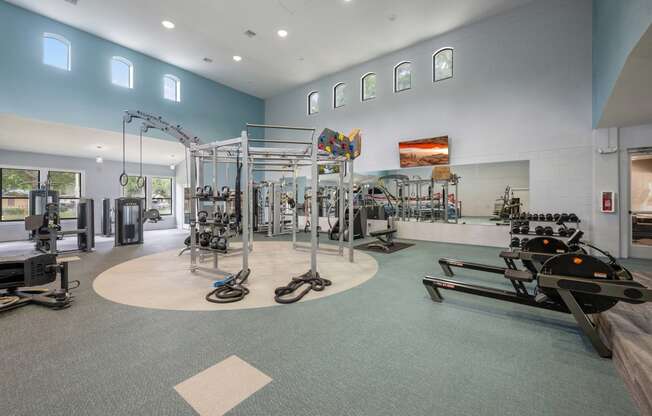 the gym at the flats at obsidian development has weights machines and other exercise equipment