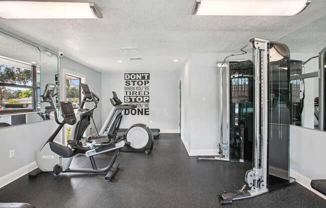 A gym with a sign that says "Don't stop when you're tired, stop when you're done."