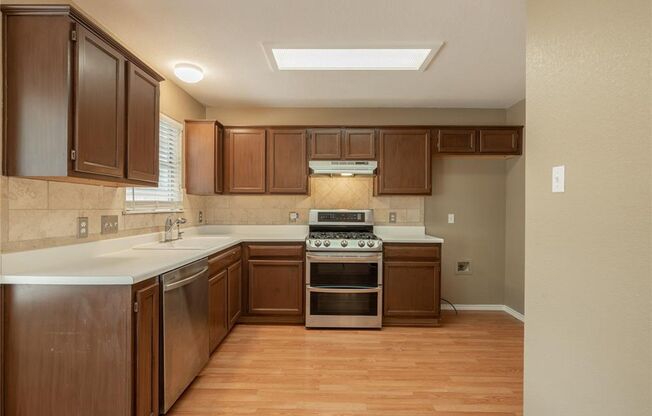 No Carpet! Tons of Space! Beautiful backyard with large covered patio!
