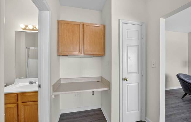 A classic style apartment with built in desk between bathroom and living room