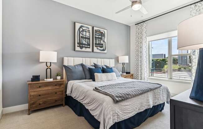 a bedroom with a large bed and a window