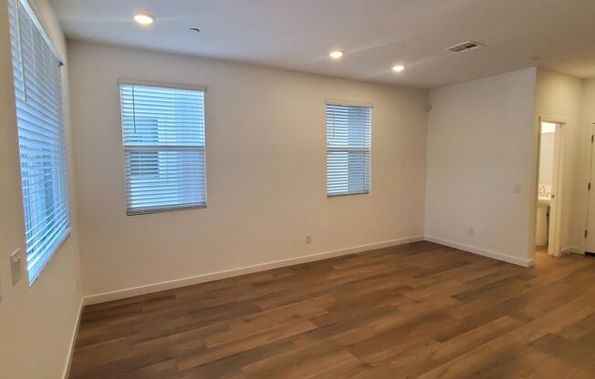 Contemporary townhome with modern exterior and attached garage.