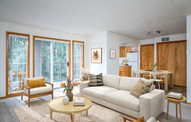 a living room filled with furniture and a large window