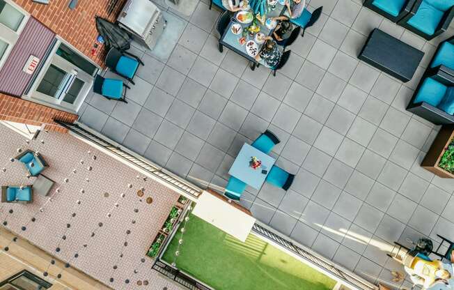 a view from above of a patio with a table and chairs