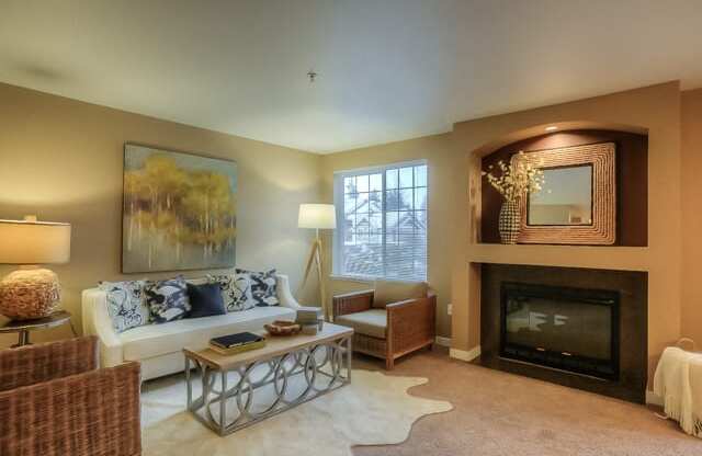 Living Area With Fireplace at Canterbury Apartments, Puyallup, 98373