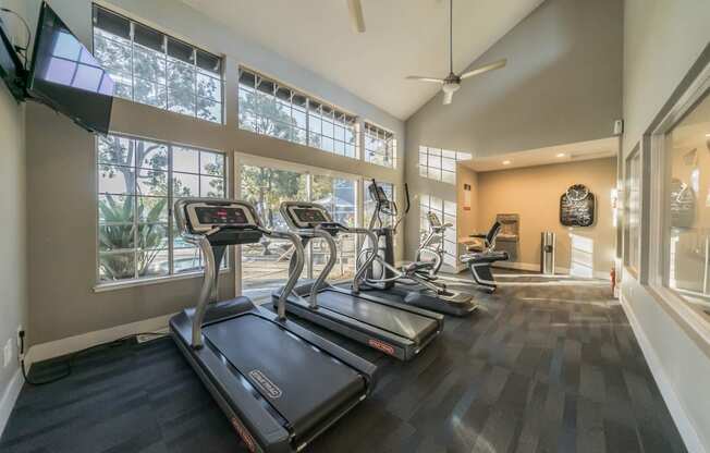 the gym in the home has treadmills and windows at Bay Village, California