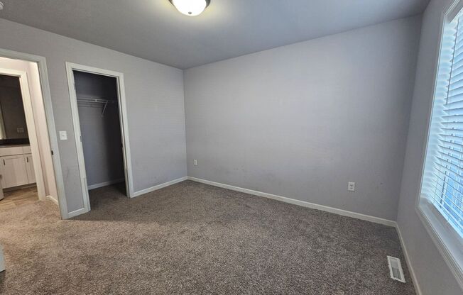 NE 2 bedroom 2 bath condo with large deck attached 2 stall garage, full unfinished basement