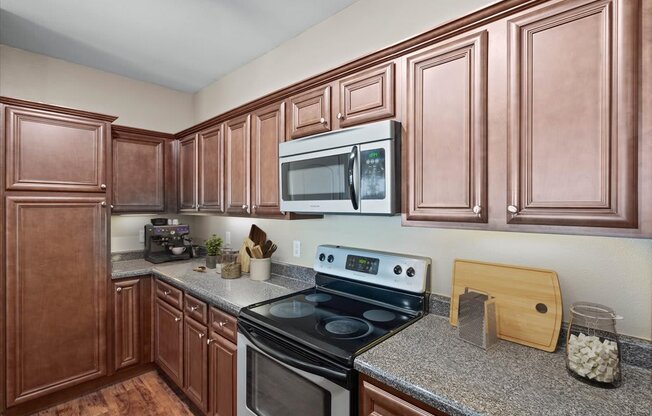 a kitchen with a stove and a microwave