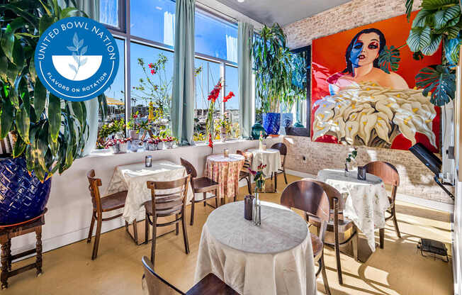 A restaurant with tables and chairs and a United Nations sign at Esprit Marina del Rey, 90292