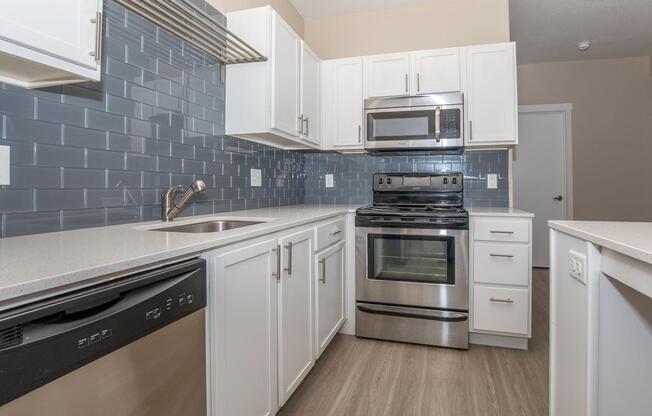 a stove top oven sitting inside of a kitchen