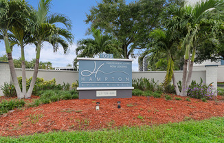 A sign for a residential living community called Hampton. at Hampton Apartments, Clearwater, FL, 33759