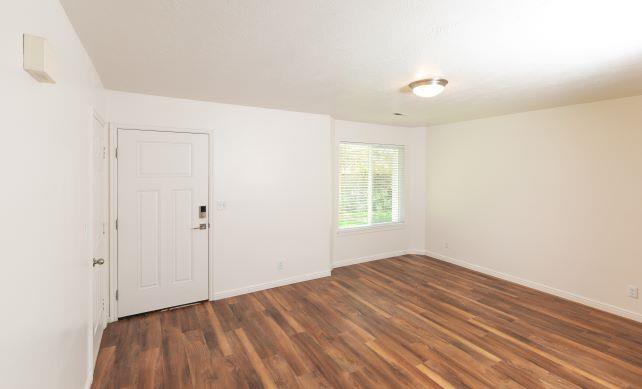 Wood Floor Living Room at Devonshire Court Apartments & Townhomes, North Logan, Utah