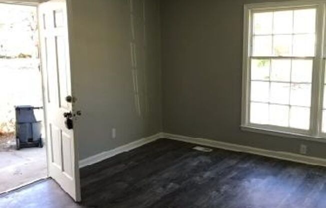 3br 1.5 bath, NEWLY RENOVATED! Garage, fenced back yard, plank flooring