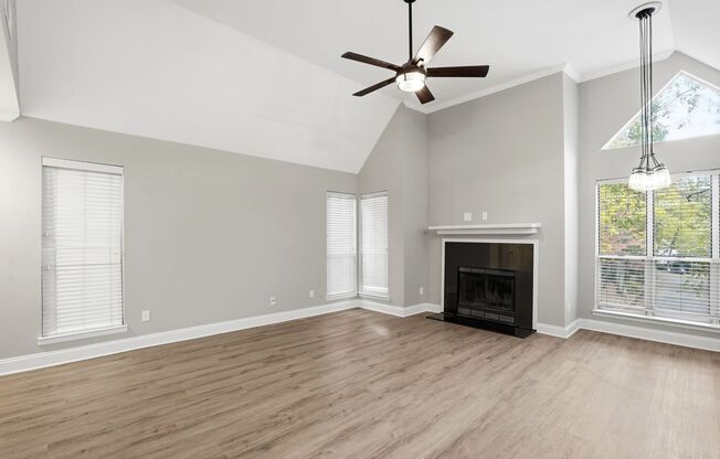 Bright Top-Floor Condo with Vaulted Ceilings & Balcony