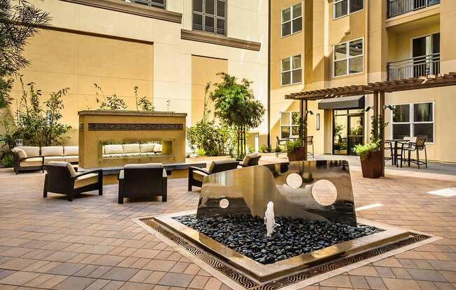 Foster City Apartments for Rent - The Plaza - Outdoor Patio with Comfortable Seating, Fire pit, and Fountain