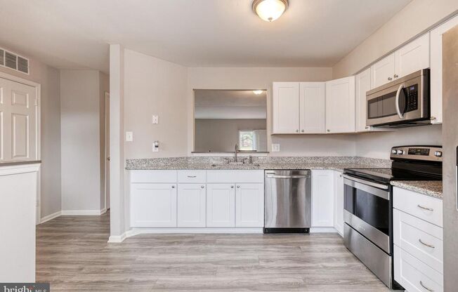 Welcome to 3 Greenshire Lane, a 3bd 2/2bth townhome in the sought after Owings Mills community of Garrison Woods