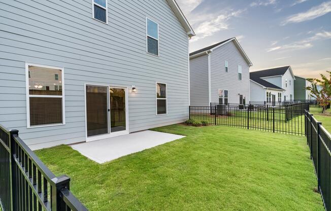 A private, fenced backyard at Amavi Brier Creek, extending your living space outdoors in a quiet Durham setting near everyday conveniences.