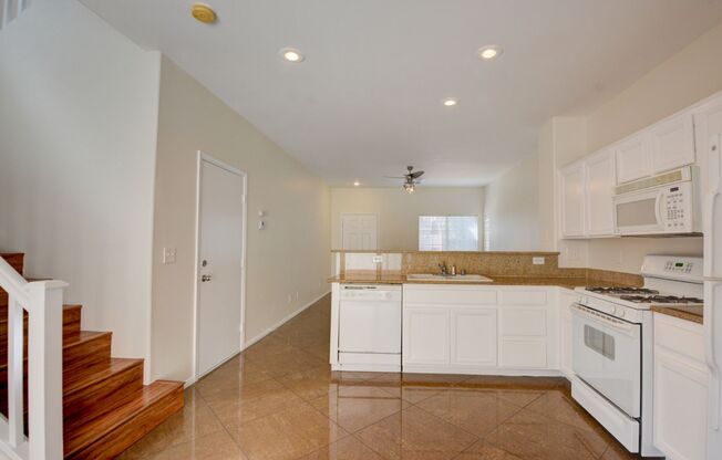 Beautiful two bedroom in great location. Step through the front door into a sun-filled great room featuring oversized tile flooring, recessed lighting, and a modern ceiling fan. Large windows and a glass slider invite natural light and frame the connectio