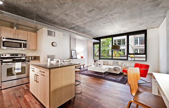 a living room with a kitchen and an open floor plan