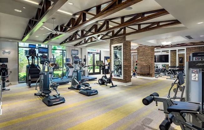 A gym with a variety of exercise equipment.