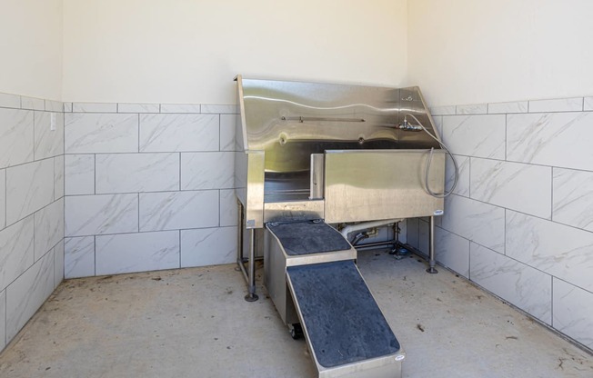 a kitchen with a stove and two stools in it