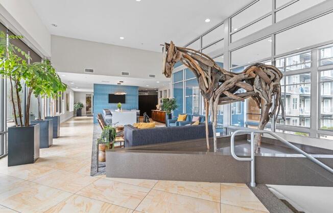 a statue of a horse in a lobby of a hotel