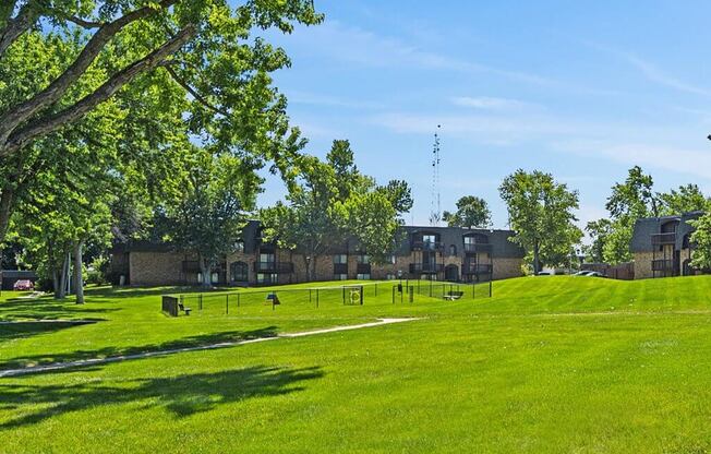 apartment community with green grass