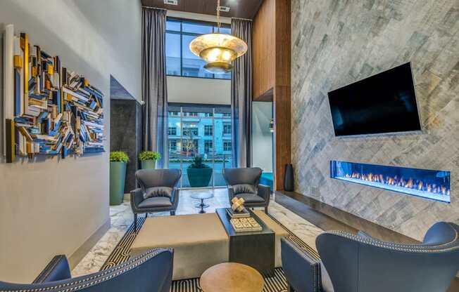 A modern living room with a television and a fireplace.