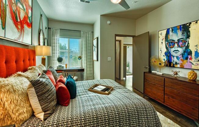 The Craft and Gilbert and Baseline second bedroom with double bed, window showing blue sky and door to the hallway.