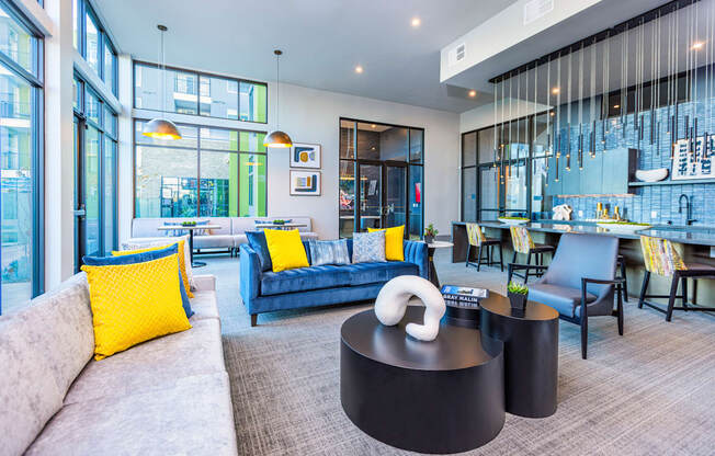 resident lounge great room with kitchen bar top seating at Zeta Luxury Apartments in Sacramento, CA
