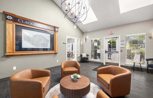 A waiting area with chairs and a map of Clackamas Trails at Clackamas Trails Apartments, Oregon, 97222